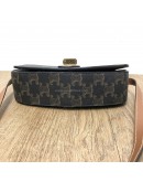 CELINE Clutch on Strap Tabou in Triomphe Canvas and Calfskin – GHW