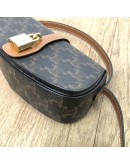 CELINE Clutch on Strap Tabou in Triomphe Canvas and Calfskin – GHW